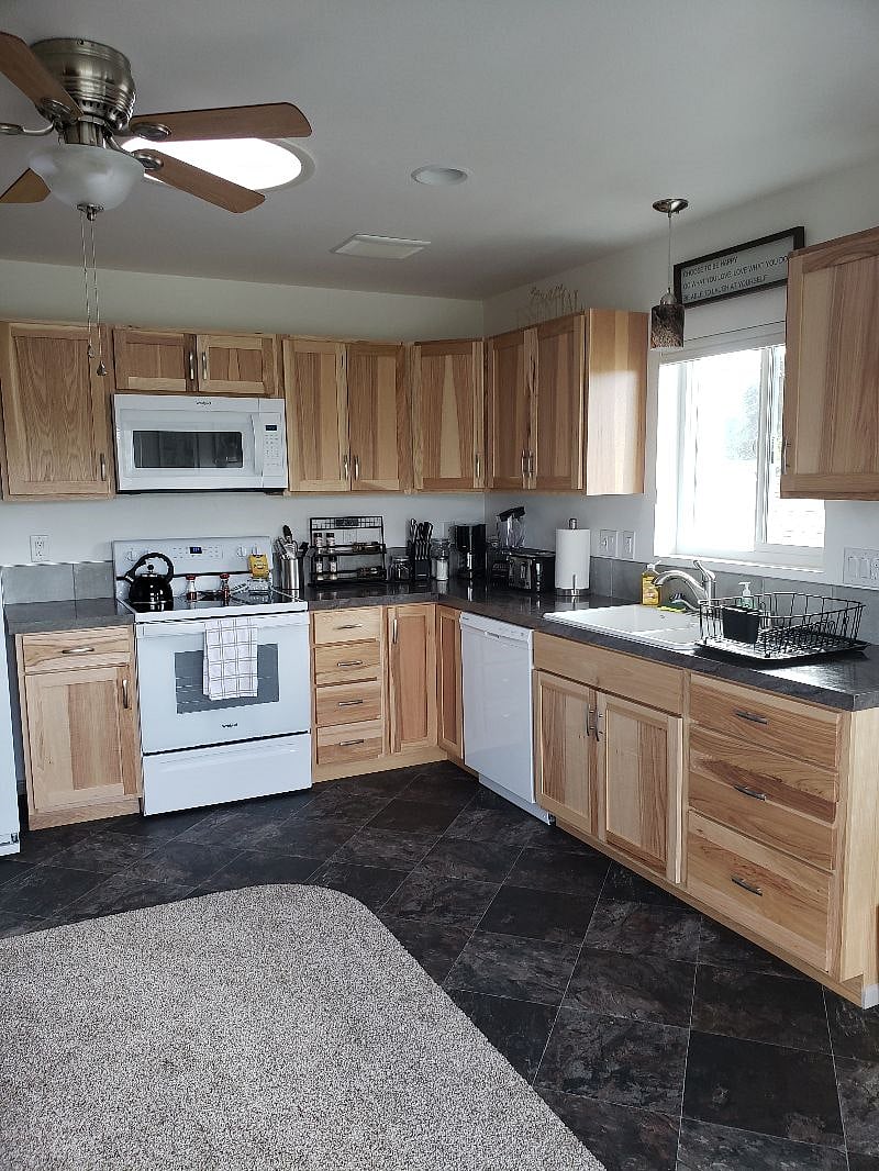 This beautiful hickory cabinet-spacious kitchen has everything...INCLUDING "the kitchen sink." If there is something missing like "where's Waldo"...Just ask and we can probably find it OR get it for your convenience. Cell charging USB's in kitchen too.
