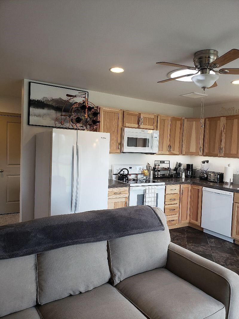 There's that bicycle-wine rack on top of the refrigerator. (if you need an amazing "wine APP" that will help you choose great wines, let me know!) The micro, and a whole bunch or counter space...AND under-cabinet lighting...Looks really nice at night.