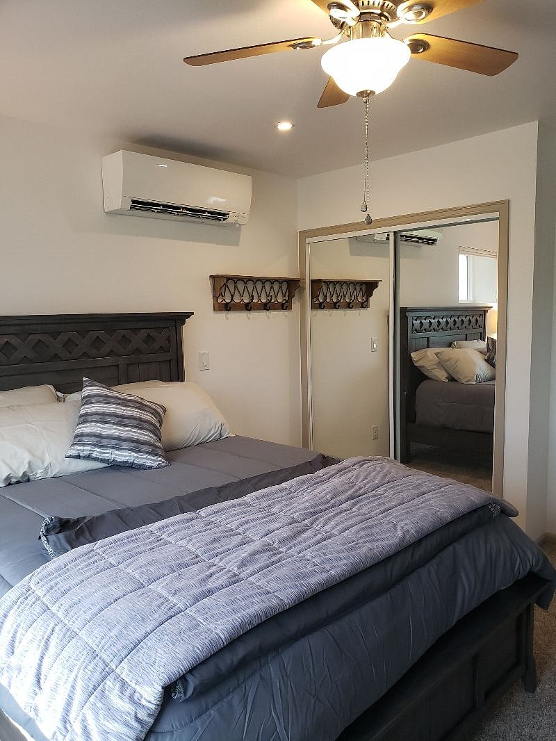 OK, one more picture of your bedroom. Looking at your 5' foot mirrored closet sliders, another place to lose your keys up on the shelve..A light switch on the wall for a swivel-light overhead facing your mirrors for more light on you.