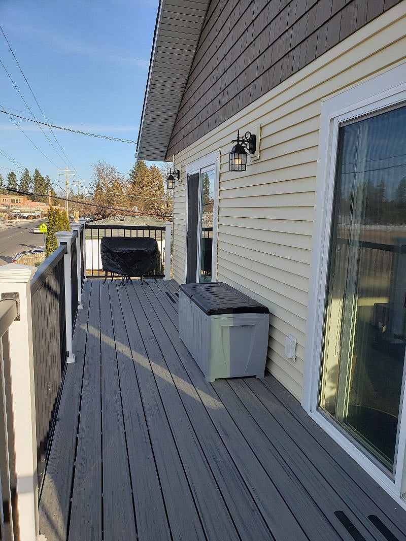 AMAZING VIEW here...Just another view of your covered bistro table & chairs and your outside storage bin that has the fire escape ladder and fold up chairs in it.