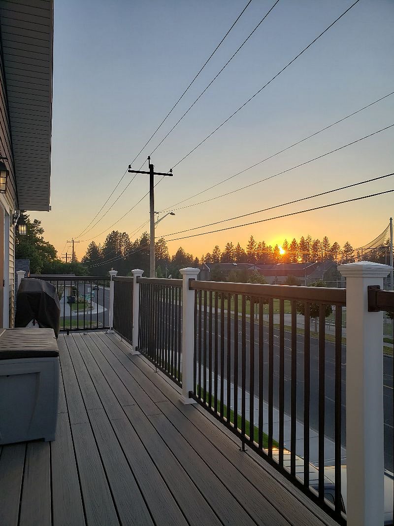 Beautiful June SUNSETS and BBQ for cooking basically 365 days...If you like grilling, You will love this...Also down below behind the privacy fence ground floor, you have a BBQ, a table for 4 and several sunning lawn chairs...OH YA...Relax!