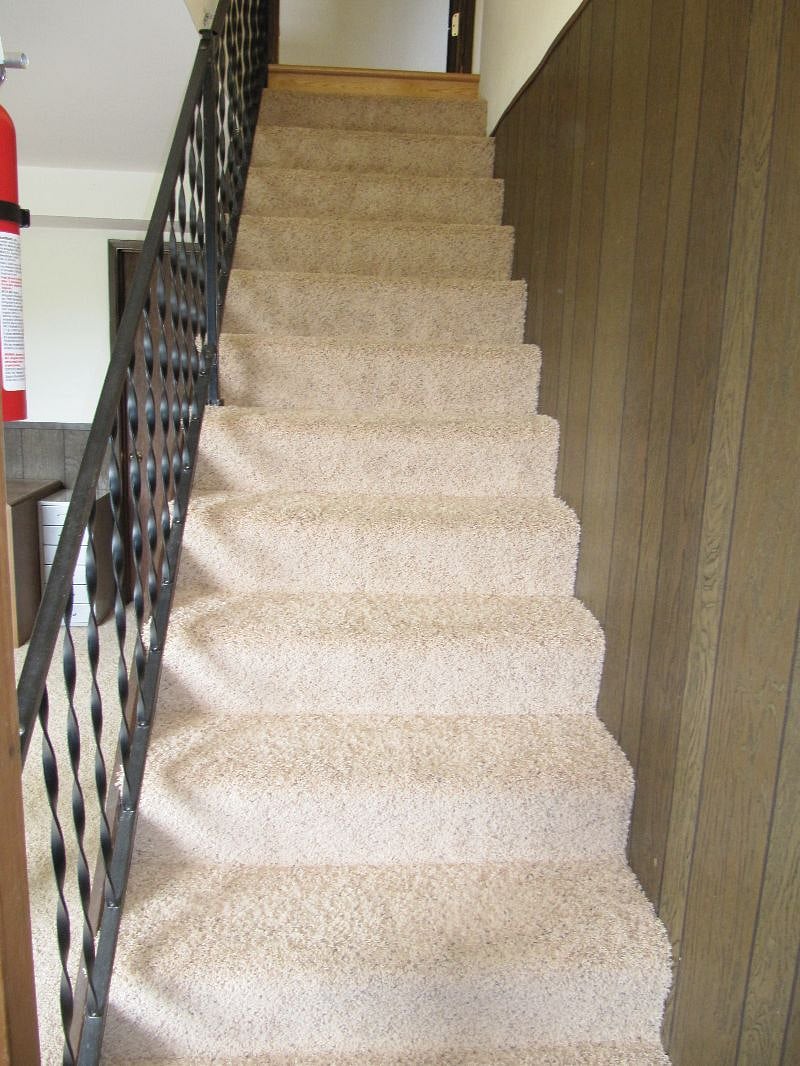 Stairs that lead upstairs to washer & dryer