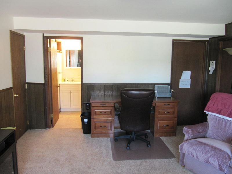 Desk next to bathroom entry.
