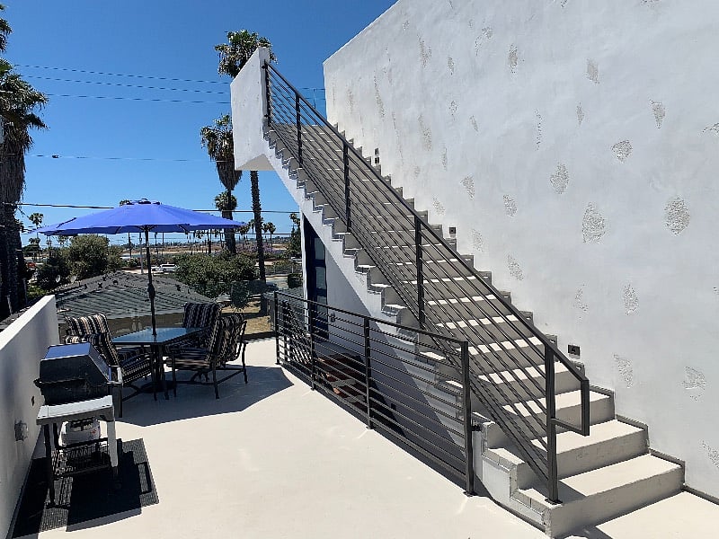 deck with stair access to roof top deck