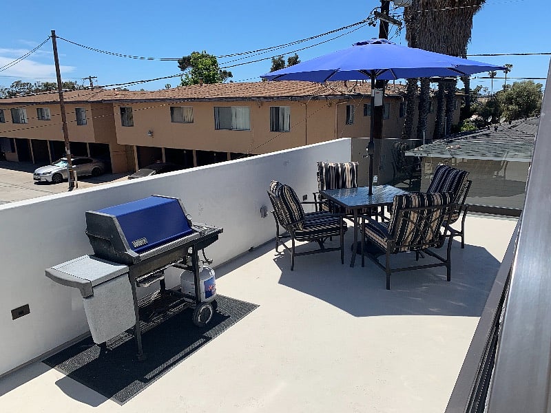 deck with grill and outdoor seating
