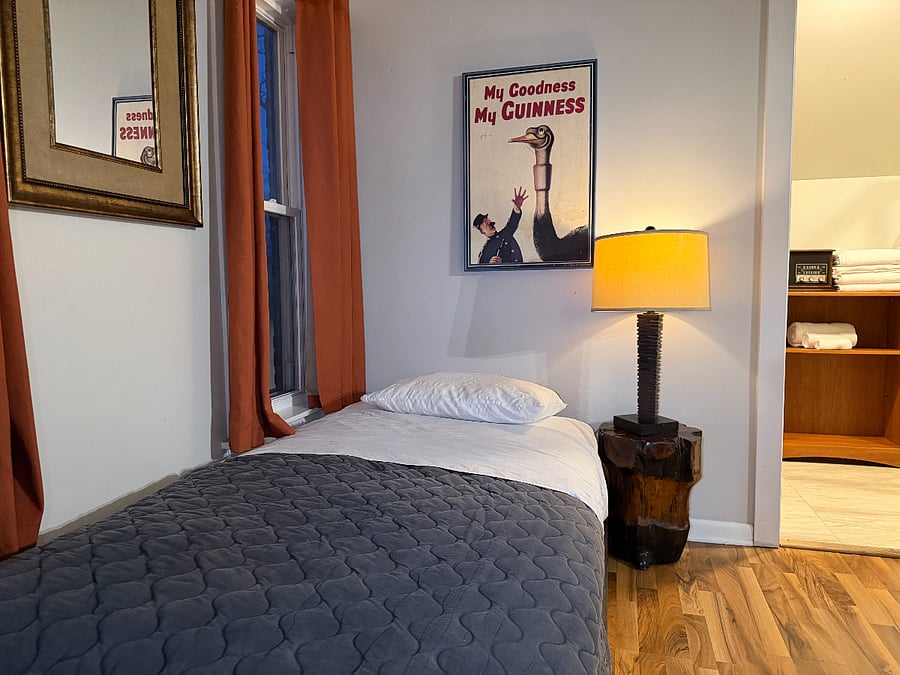 A cozy living area with a comfortable twin bed, ideal for unwinding after a busy day