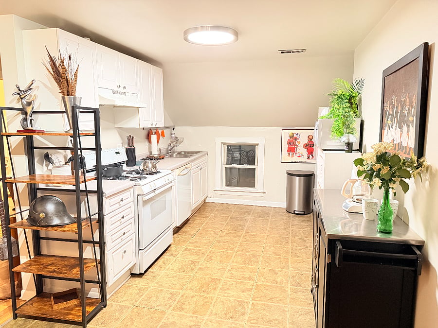 The kitchen is fully equipped with cookware, dishes, utensils and essentials, making meal preparation easy for extended stays.