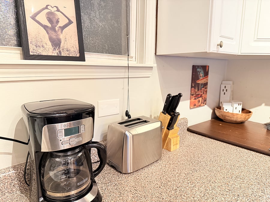 Start your day right in a fully equipped kitchen featuring a coffee maker, toaster, and everything you need for easy meals. Clean, modern, and designed for convenience, it's perfect for preparing delicious home-cooked meals.