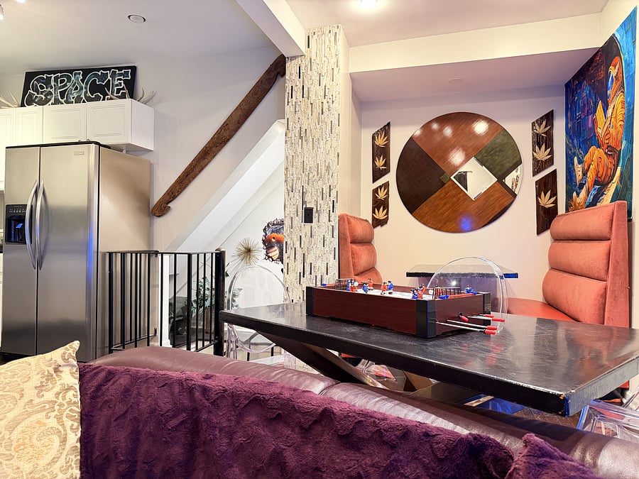 Dining nook with comfortable booth seating, contemporary accents, and bold artwork. An inviting spot for meals, coffee, or conversation.
Enjoy a tabletop game setup for relaxed dining and some friendly competition.