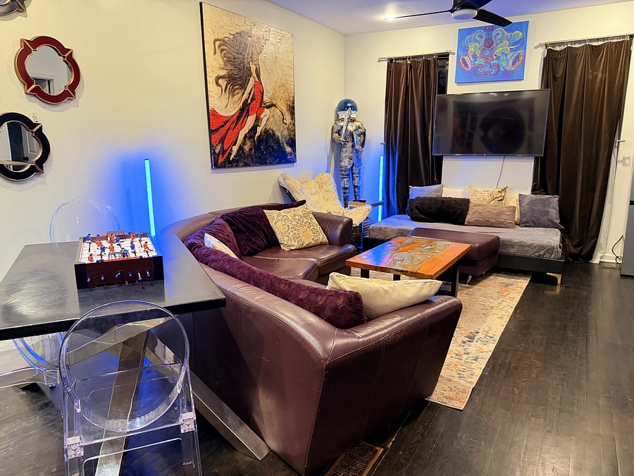Open-concept living space with cozy seating, modern lighting, and unique art pieces.
Enjoy a tabletop game setup for some friendly competition.