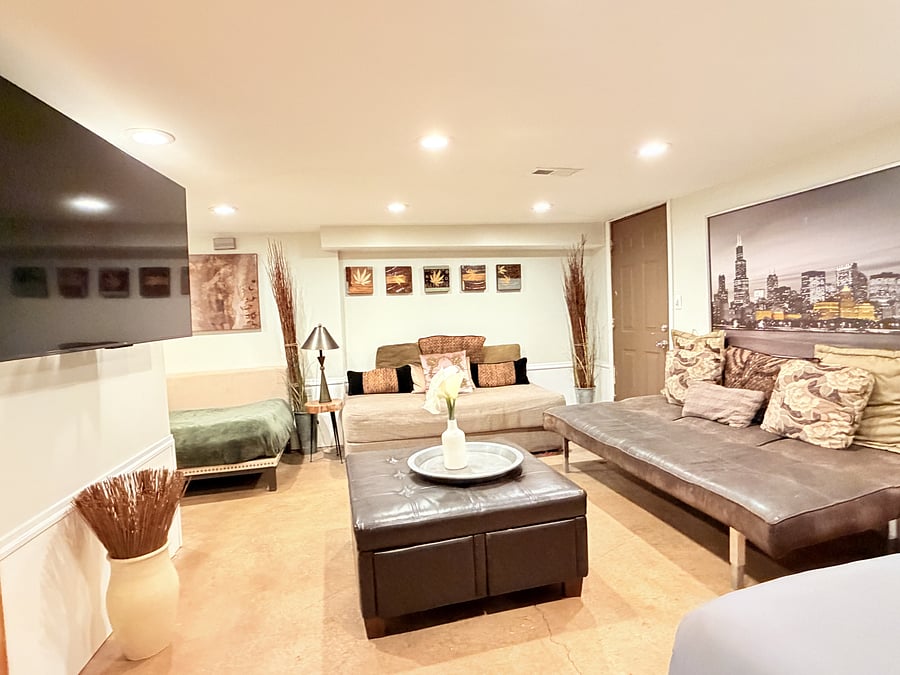 A spacious bedroom that doubles as a cozy mini living area, with a TV for your entertainment. Enjoy a comfortable bed, modern seating, and warm lighting, all thoughtfully arranged to create the perfect space to unwind, relax, and feel right at home.