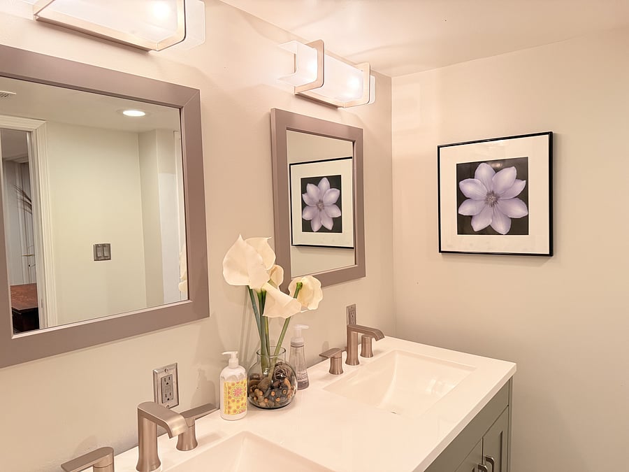 Enjoy a relaxing, bright, and modern bathroom featuring a stylish vanity, fresh towels, and essential amenities in a clean, spacious layout. Perfect for starting and ending your day in comfort.