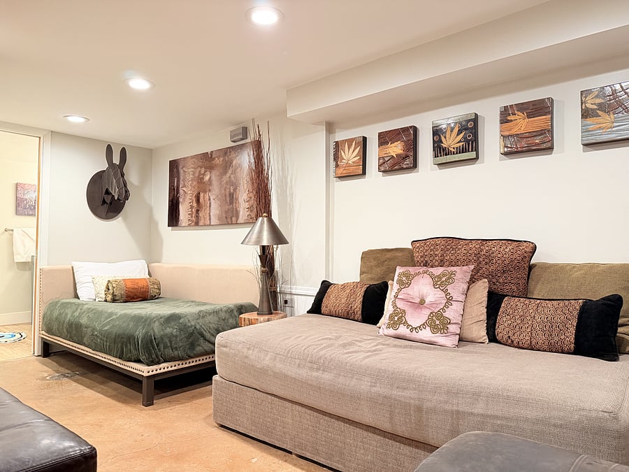 A spacious bedroom that doubles as a cozy mini living area, thoughtfully designed for both comfort and style. Enjoy a comfortable bed, modern seating, and warm lighting, creating the perfect space to unwind and feel right at home.