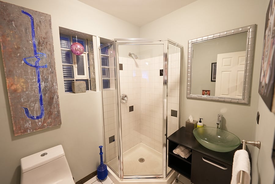 A clean, modern walk-in shower, toilet and essentials, designed for a refreshing and comfortable experience.