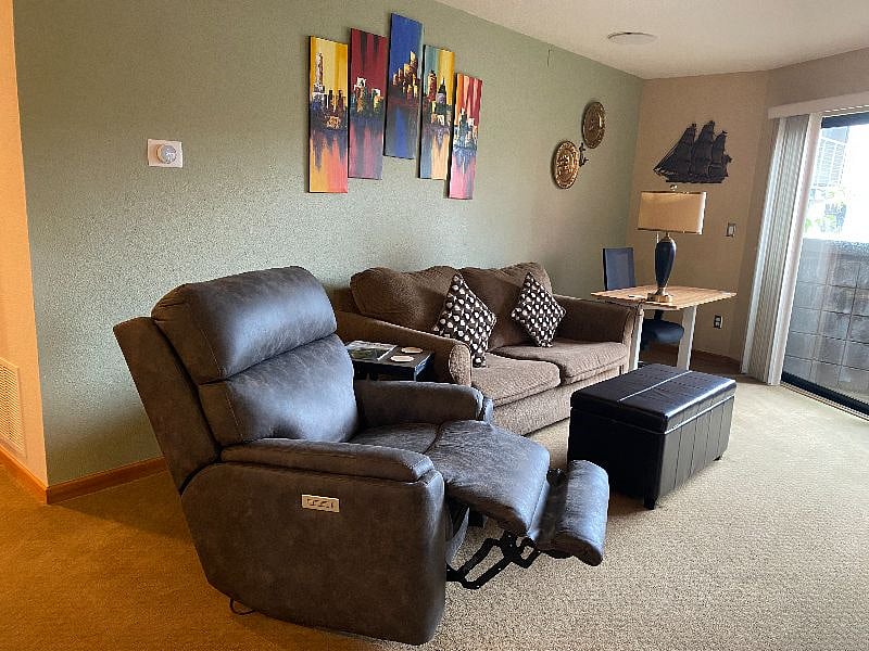 Most comfy high end Ashley recliner with adjustable head-rest. Will be covered with custom cover if pets in the condo.