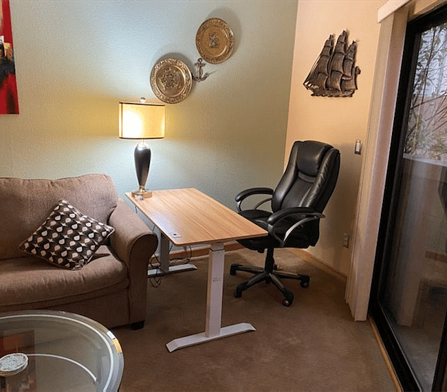 Fully Ergonomic work area with auto adjustable height desk, and a newer ergonomic chair (this picture shows previous leather chair, not te new erg. one)