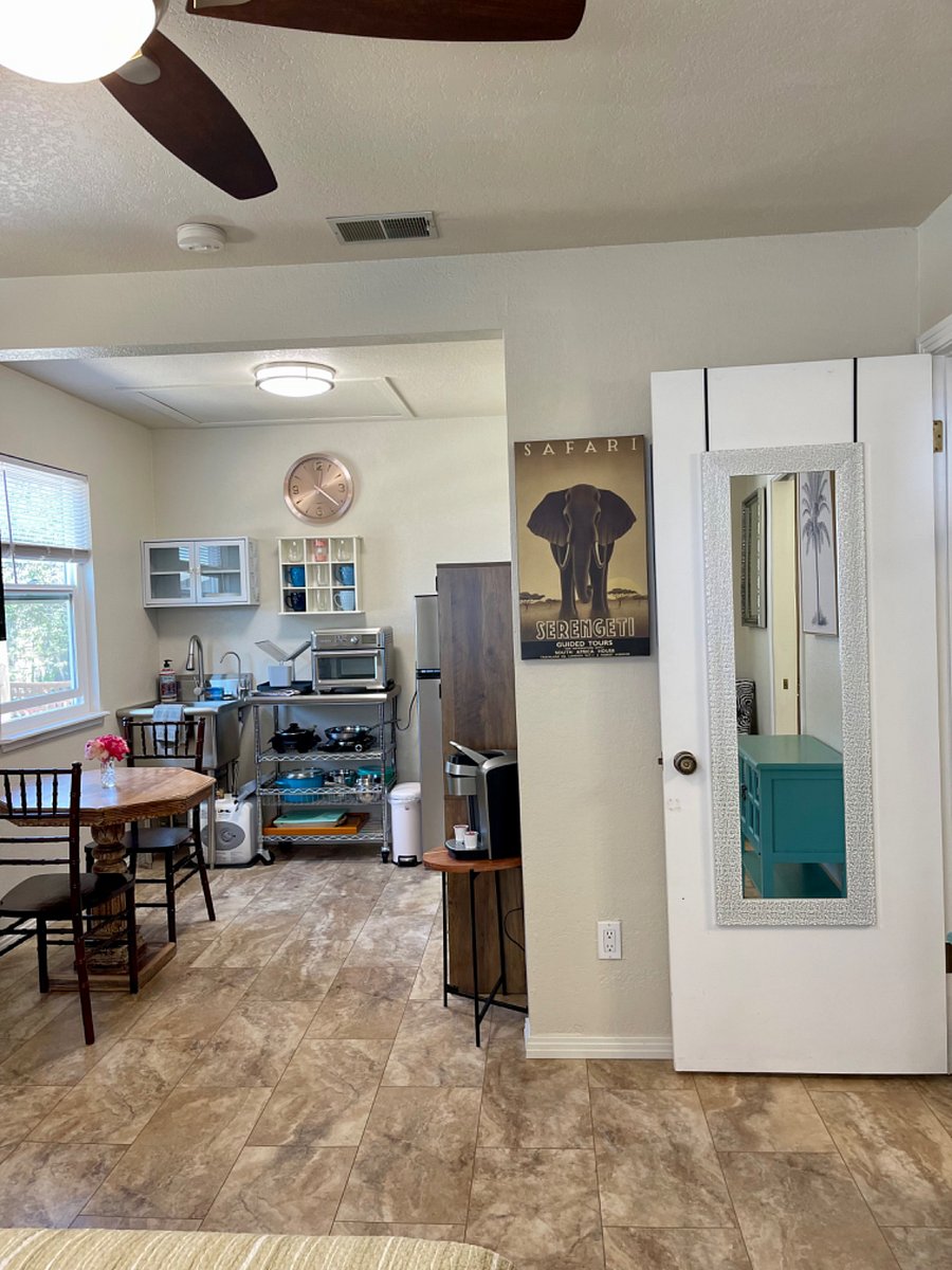 Newly painted kitchen, table and chairs with lots of natural light, and fresh air.