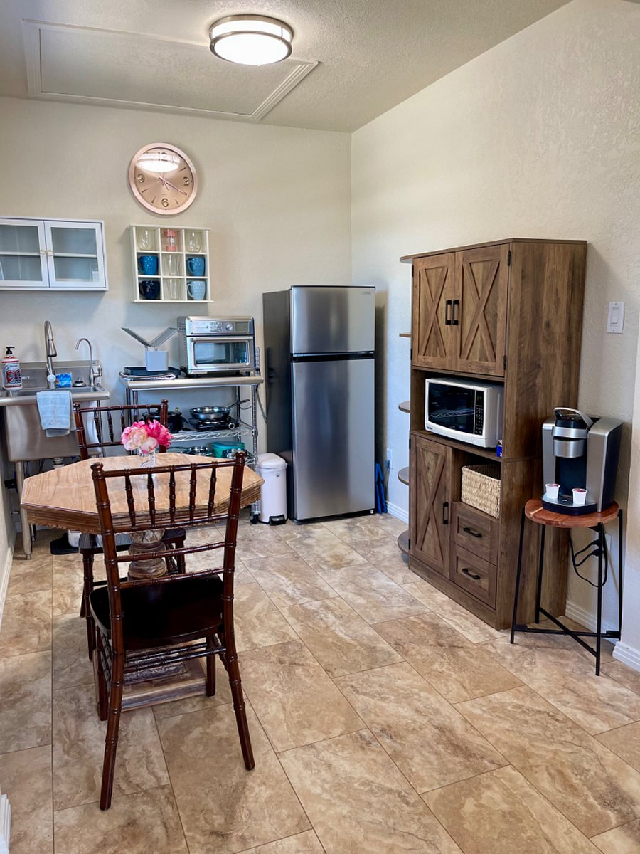 Kitchen features cabinets, microwave, induction cooktop, convection oven, and coffee machine.
Instant hot water heater, filtered water, and essentials.