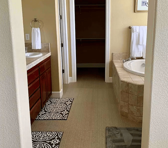 A bath tub features in the bathroom