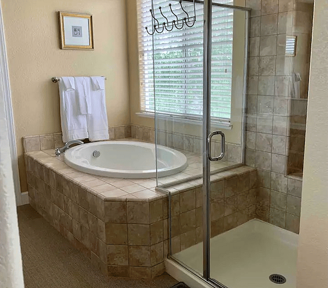 A bath tub features in the bathroom