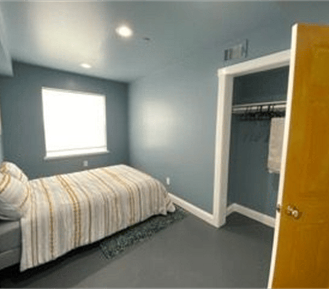 Orange door bedroom with built-in closet