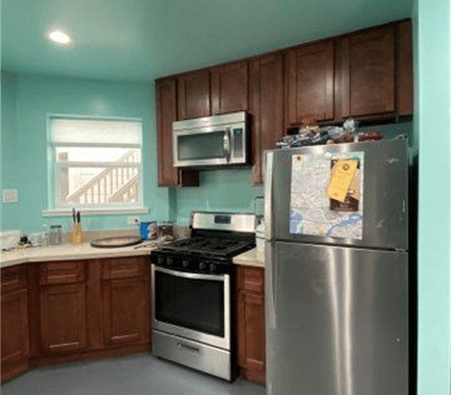 Microwave, gas cooktops, oven and 2 fridges!