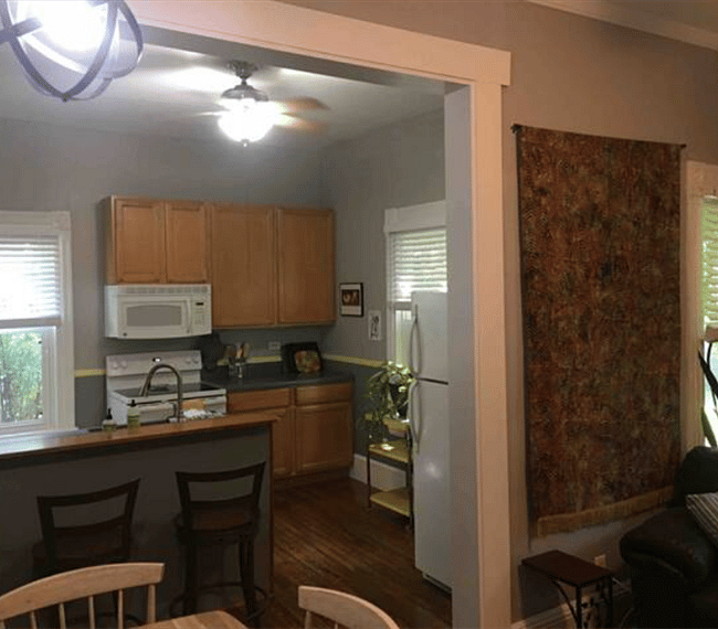 Stove and microwave, open floor plan into living room