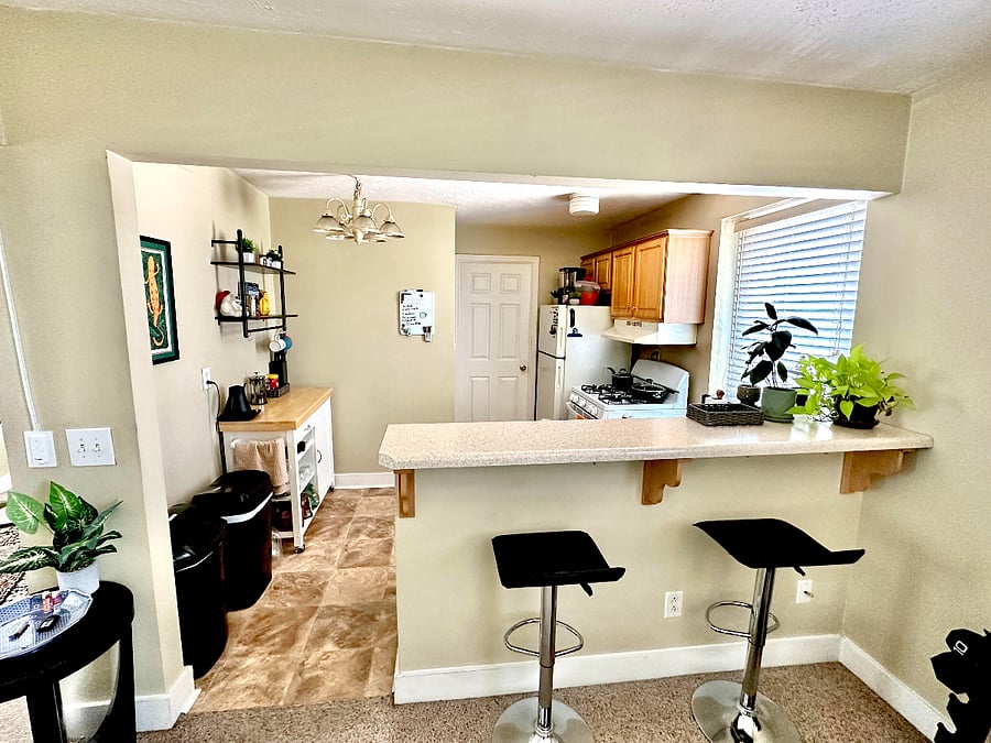 Bright and spacious open kitchen with bar stools