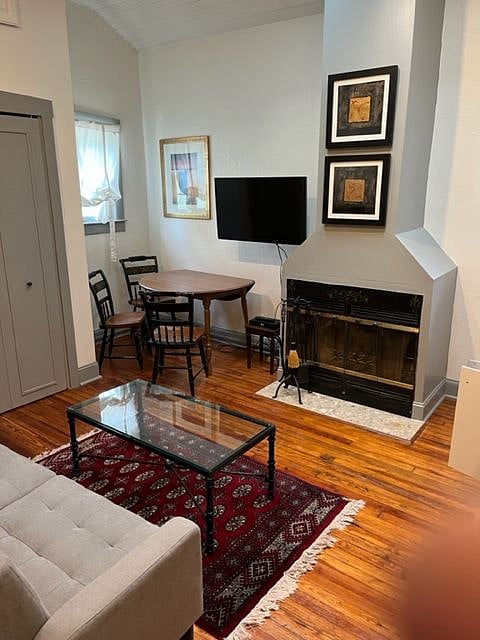 Working fireplace and small dining table. Cable television also included.