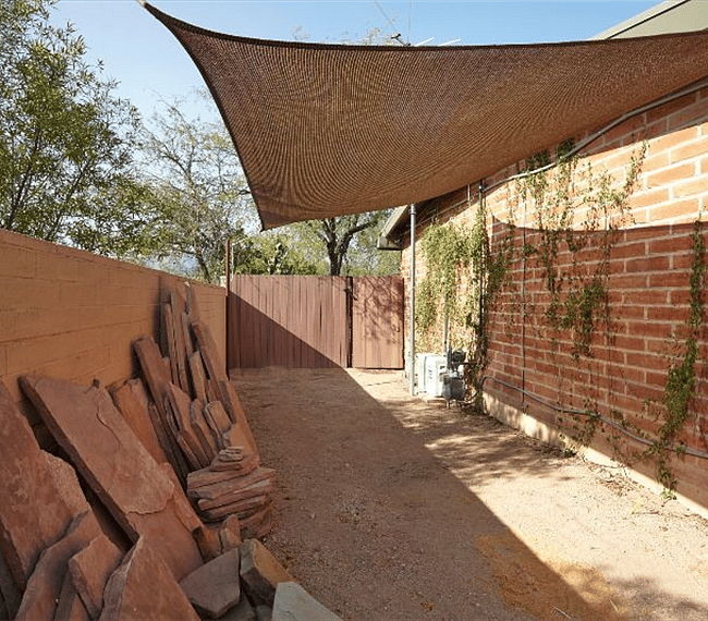 This is a pvt patio and entrance to your studio. It will become a flagstone patio. This can be used as your own dog run.