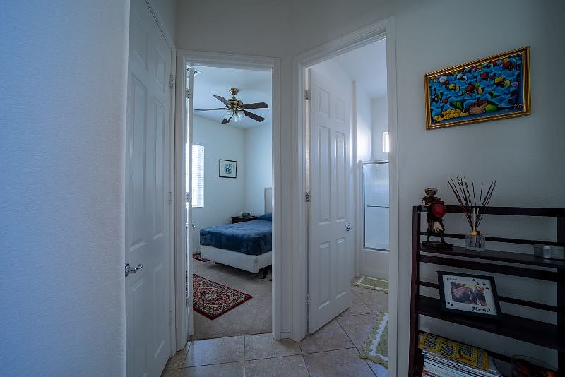 Downstairs, the third bedroom, and its adjacent bathroom.