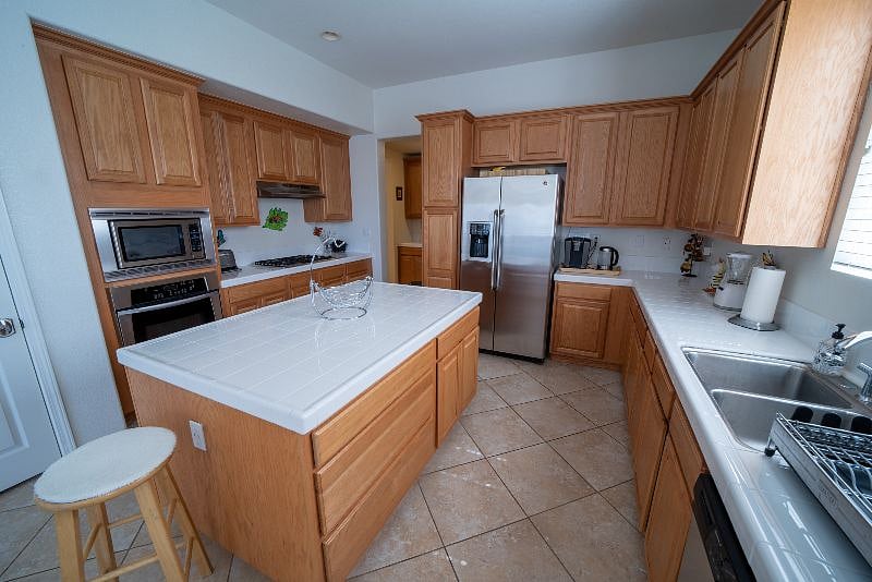 A large, fully equipped kitchen where all can gather.