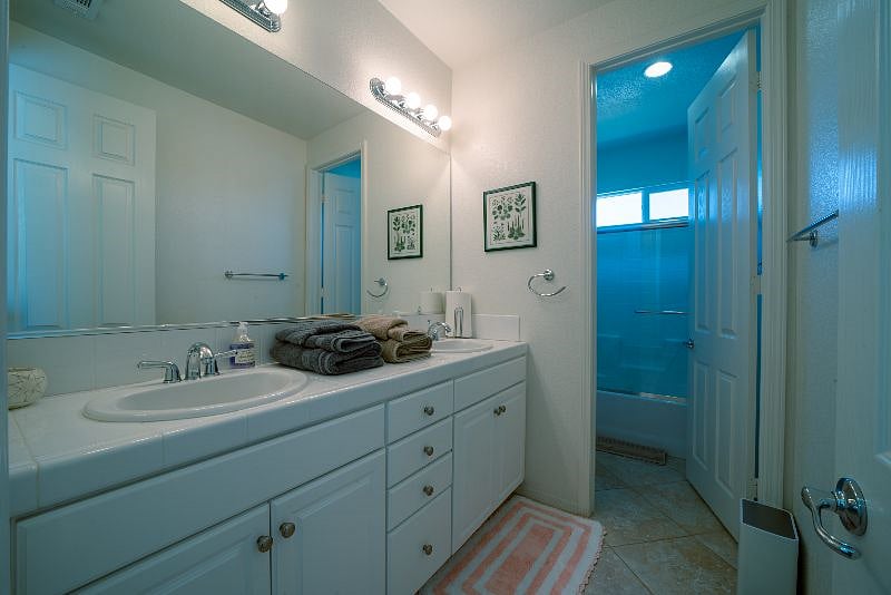 Upstairs Bathroom with double-sink vanity, and privacy...