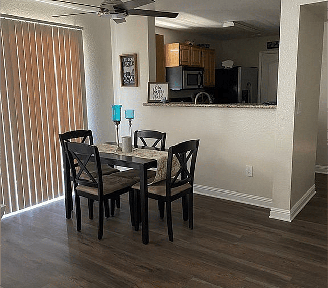 dining area with sliding door to balcony