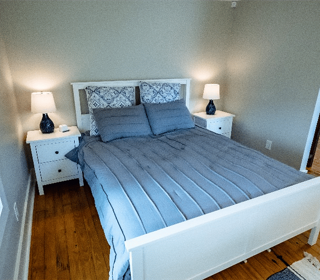 Queen sized bed and charming night stands