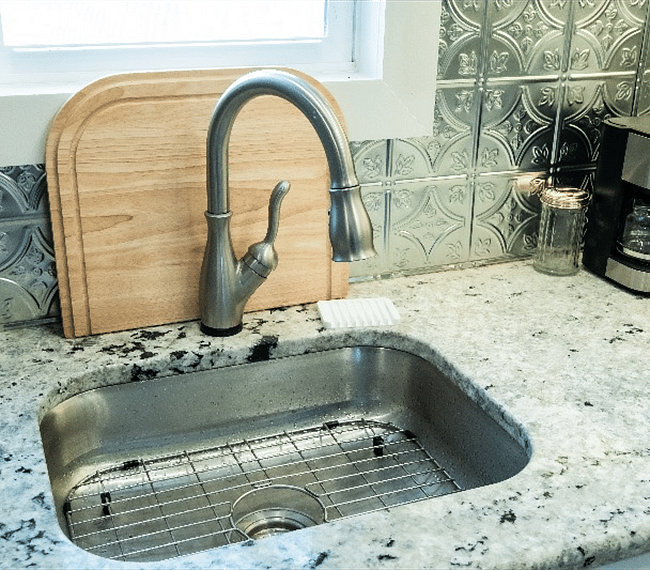 stainless sink with a Delta Touch faucet