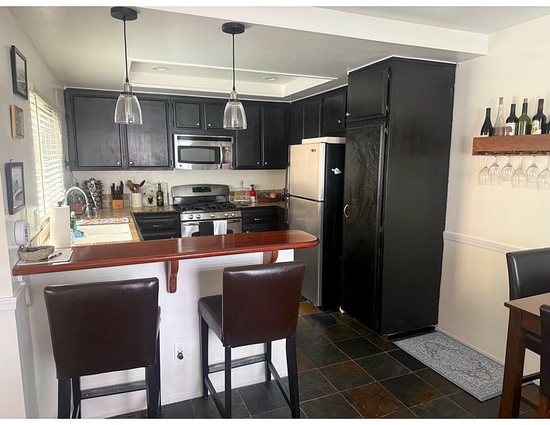 full kitchen with all the basic appliances- toaster, kettle, Nespresso, Ninja blender