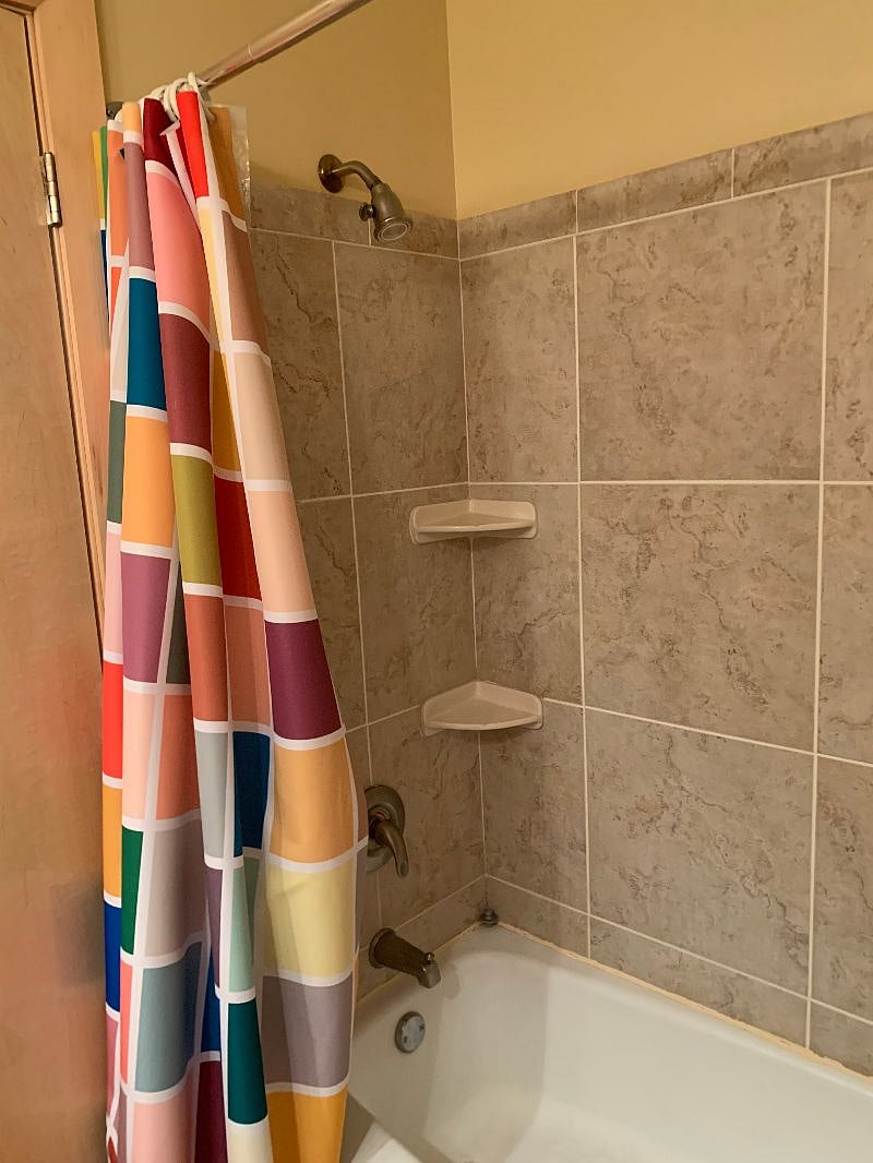 A shower features in the bathroom 