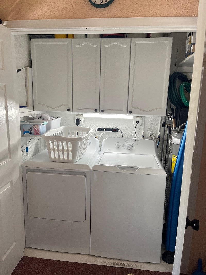 Washer and Dryer in the Lanai behind to doors.