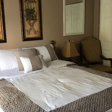 Comfortable Queen size bed with side chair. Large bureau and a spacious closet. 