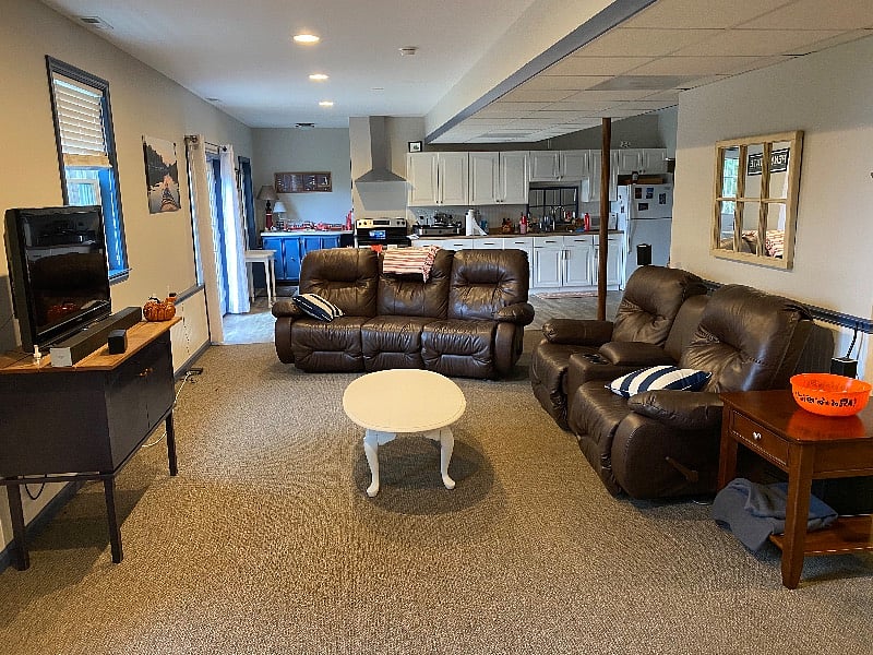 Living room with 2 leather couches that recline