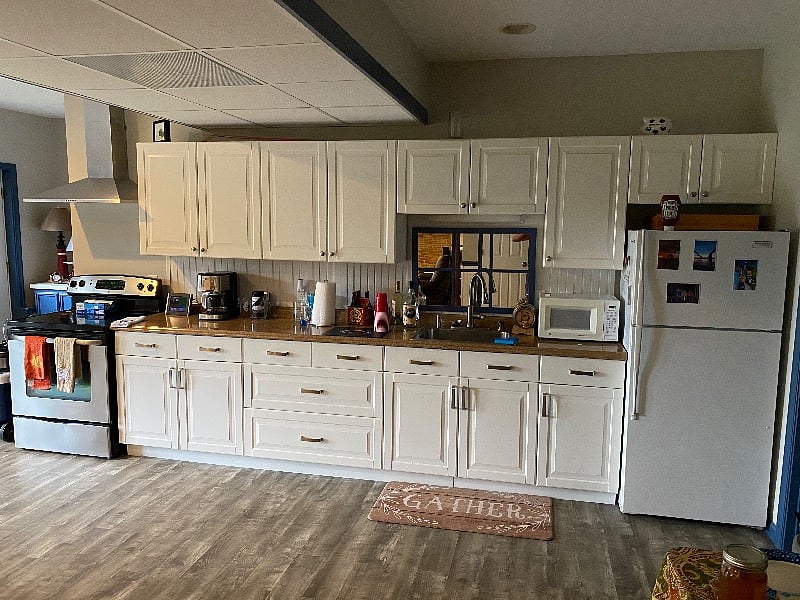 Full size spacious kitchen stocked with appliances and utensils