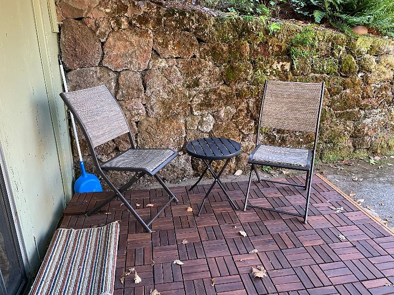 Deck area in front of entrance at the bottom of the driveway.
