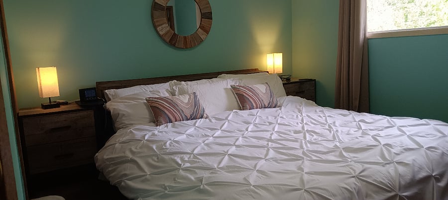 California King bed in master bedroom. Portable A/C unit for this bedroom.