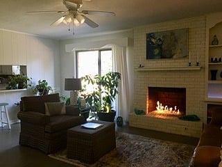 Den with fireplace and tv