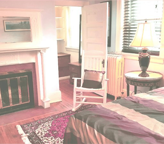 Bedroom fireplace, these windows face the quiet courtyard garden