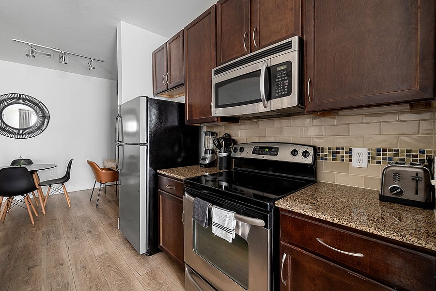 Cook up a storm in this fully equipped kitchen, featuring modern appliances, ample counter space, and everything you need to feel at home.