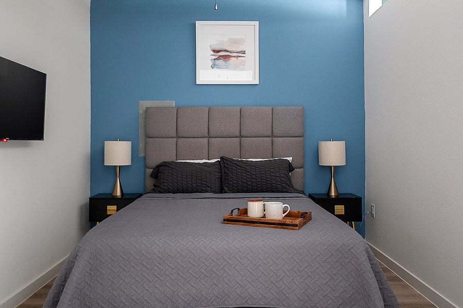 Bedroom with Accent Wall and Lighting