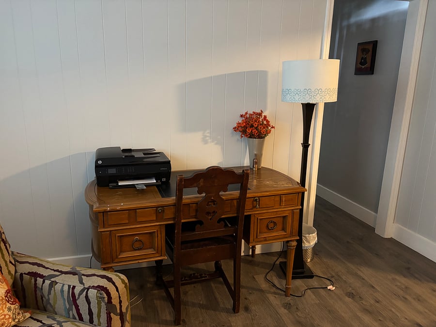 Desk with easy laptop hook up and wireless printer availability in main living area. 