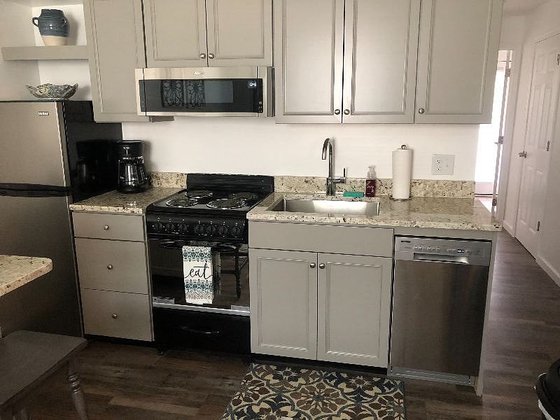 fully equipped kitchen with granite countertops